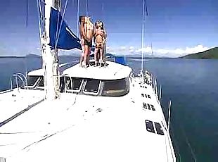 Two babes, two hunks on a boat in the sun get to some heavy sex